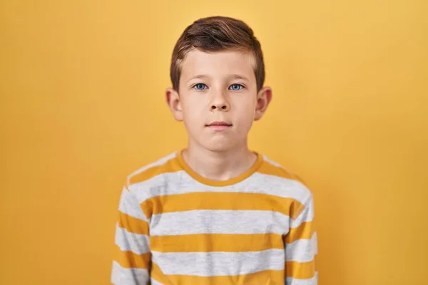 Young Caucasian Kid Standing Yellow Background Relaxed Serious Expression Face — Foto Stock