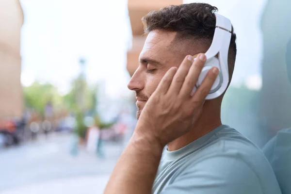 Young Hispanic Man Listening Music Standing Street — Foto de Stock