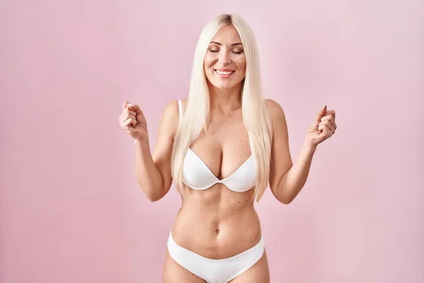 Caucasian Woman Wearing Lingerie Pink Background Excited Success Arms Raised — Foto Stock