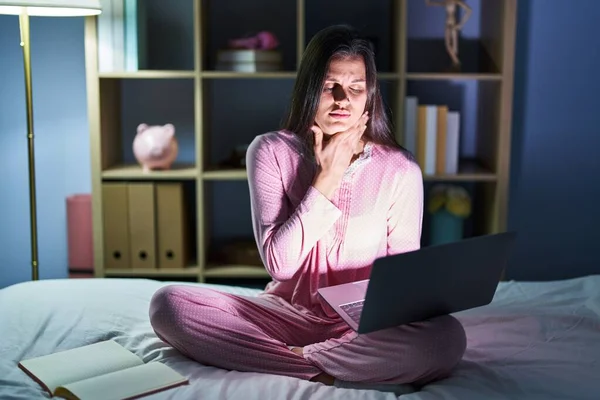 Young Hispanic Woman Using Computer Laptop Bed Touching Painful Neck —  Fotos de Stock
