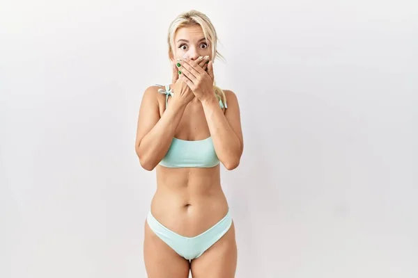 Young Caucasian Woman Wearing Bikini Isolated Background Shocked Covering Mouth — Stockfoto