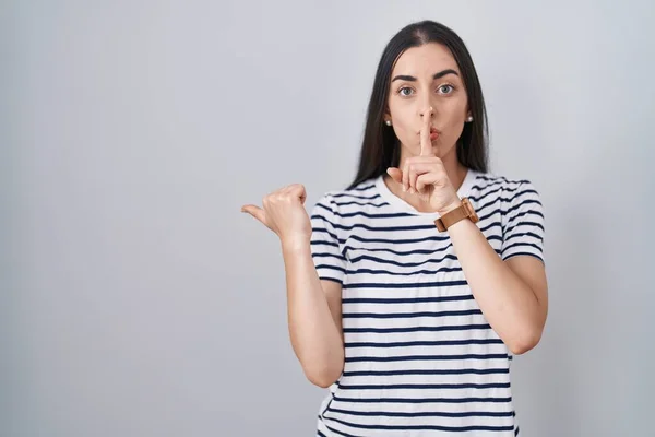Young Brunette Woman Wearing Striped Shirt Asking Quiet Finger Lips — Stock Photo, Image