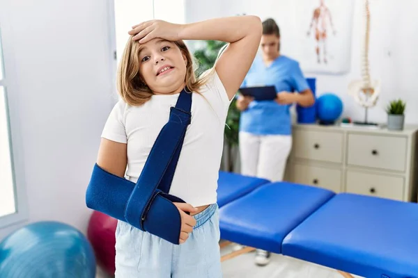 Blonde Little Girl Wearing Arm Sling Rehabilitation Clinic Stressed Frustrated — Stockfoto