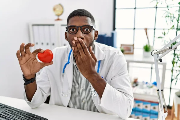 Young African American Doctor Man Wearing Doctor Uniform Holding Heart — Stock Photo, Image