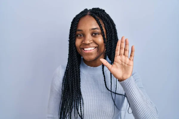 African American Woman Standing Blue Background Waiving Saying Hello Happy — Fotografia de Stock