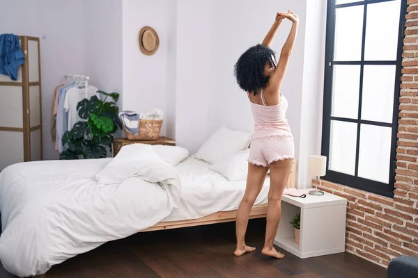 Young Hispanic Woman Waking Stretching Arms Standing Bedroom — 图库照片