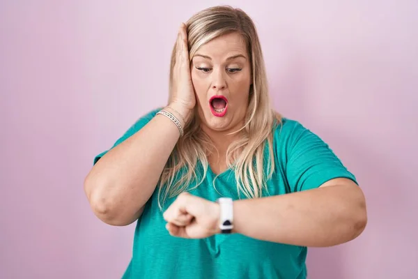 Caucasian Size Woman Standing Pink Background Looking Watch Time Worried — Stock Photo, Image