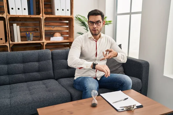 Young Hispanic Man Beard Working Consultation Office Hurry Pointing Watch — Stockfoto