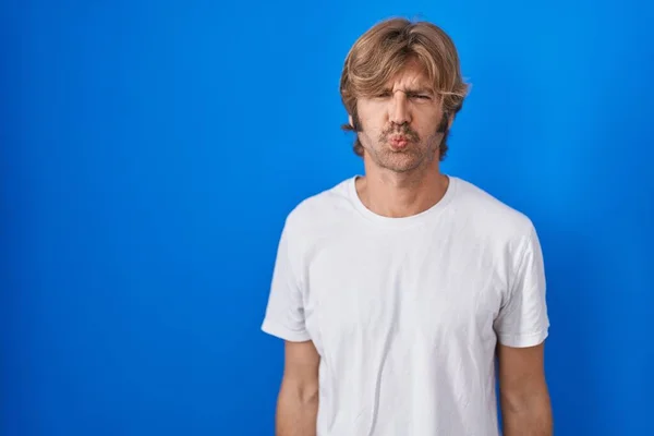 Middle Age Man Standing Blue Background Puffing Cheeks Funny Face — Stockfoto
