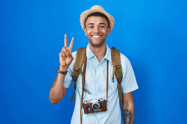 Brazilian Young Man Holding Vintage Camera Showing Pointing Fingers Number —  Fotos de Stock