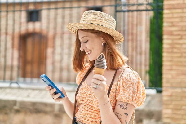 Young Redhead Woman Tourist Using Smartphone Eating Ice Cream Street — Zdjęcie stockowe