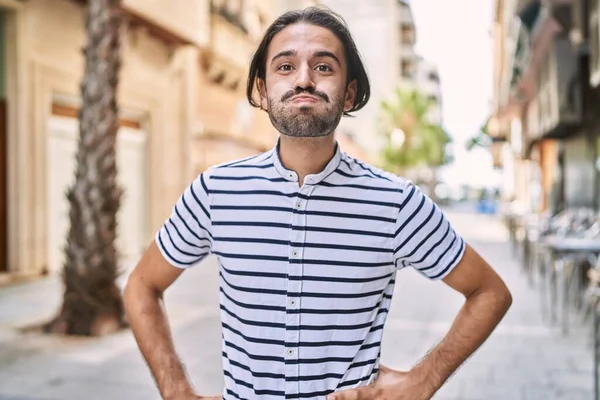 Young Hispanic Man Beard Outdoors City Puffing Cheeks Funny Face — ストック写真