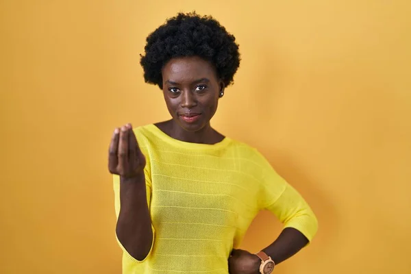 African Young Woman Standing Yellow Studio Doing Italian Gesture Hand — Zdjęcie stockowe