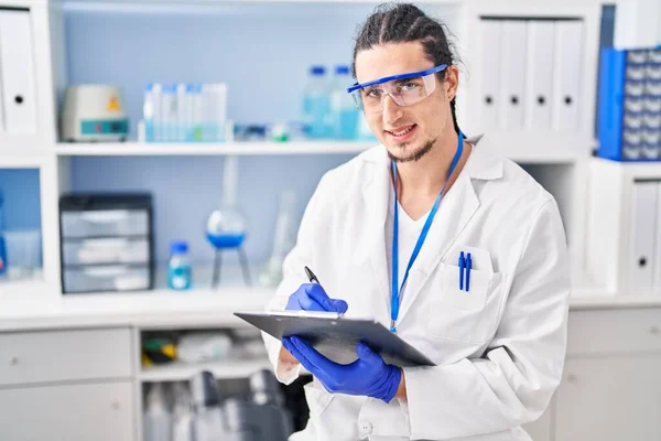 Young Man Wearing Scientist Uniform Write Clipboard Laboratory — Stockfoto