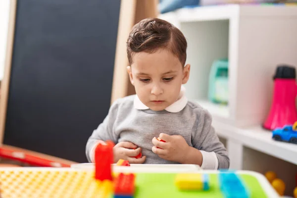 Adorable Hispanic Toddler Playing Construction Blocks Sitting Table Kindergarten — Fotografia de Stock