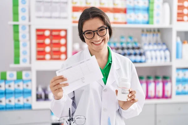 Young Hispanic Woman Pharmacist Holding Prescription Pills Bottle Pharmacy — Foto de Stock