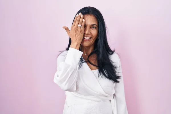 Mature Hispanic Woman Standing Pink Background Covering One Eye Hand — Stock Photo, Image