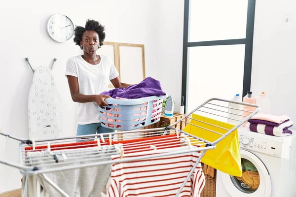 African Young Woman Doing Laundry Clothesline Puffing Cheeks Funny Face —  Fotos de Stock