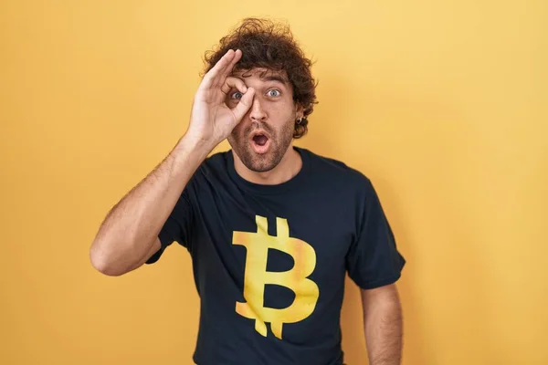 Hispanic Young Man Wearing Bitcoin Shirt Doing Gesture Shocked Surprised — Foto de Stock