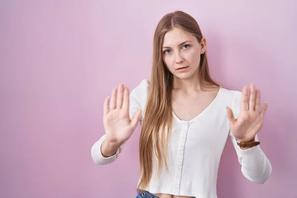 Young Caucasian Woman Standing Pink Background Moving Away Hands Palms — Stock Photo, Image