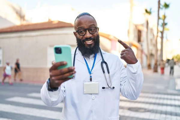African American Man Wearing Doctor Uniform Doing Video Call Smartphone — Stockfoto