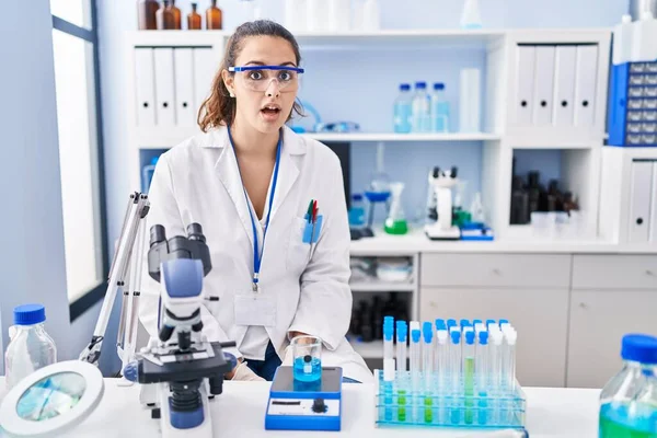 Young Hispanic Woman Working Scientist Laboratory Afraid Shocked Surprise Expression — Fotografia de Stock