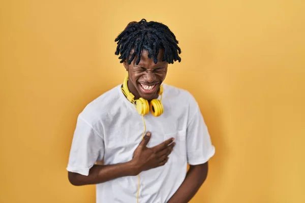 Young African Man Dreadlocks Standing Yellow Background Smiling Laughing Hard — Stok fotoğraf