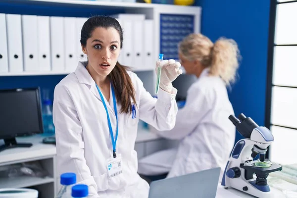 Young Hispanic Woman Working Scientist Laboratory Scared Amazed Open Mouth — Stock Photo, Image