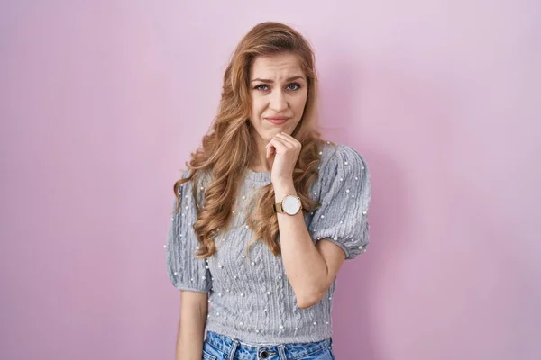 Beautiful Blonde Woman Standing Pink Background Thinking Worried Question Concerned — Stok fotoğraf