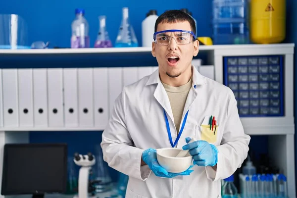 Young Arab Man Working Scientist Laboratory Angry Mad Screaming Frustrated — Stock Photo, Image