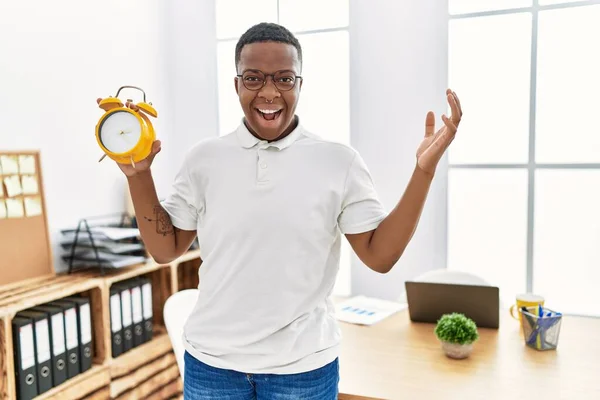 Young African Man Holding Alarm Clock Office Celebrating Victory Happy — Foto Stock