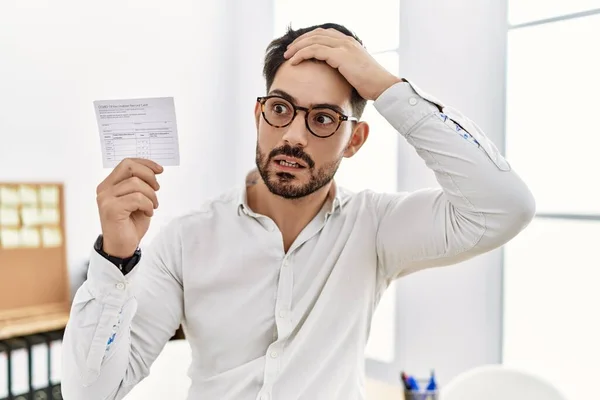 Young Man Beard Holding Covid Record Card Stressed Frustrated Hand — Foto de Stock