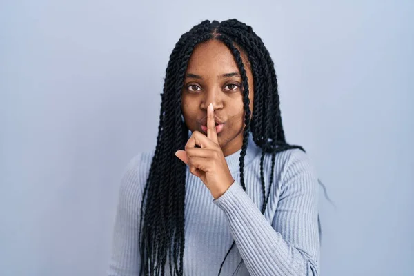 African American Woman Standing Blue Background Asking Quiet Finger Lips — Stockfoto