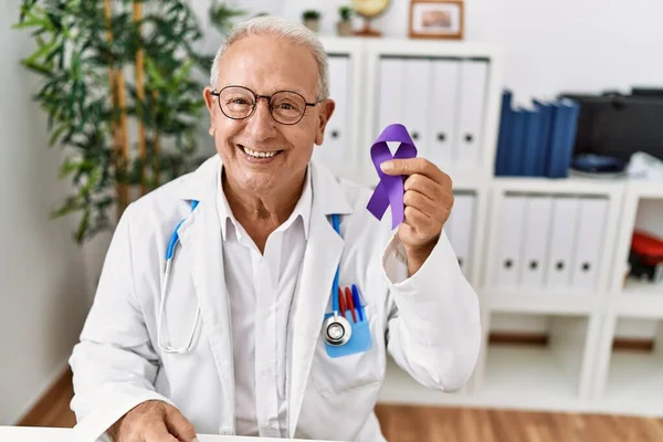 Senior Doctor Man Holding Purple Ribbon Awareness Looking Positive Happy — Stock Photo, Image
