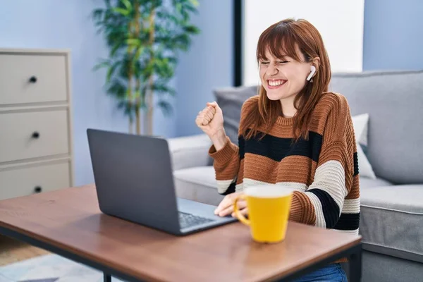 Young Beautiful Woman Using Computer Laptop Doing Video Call Screaming — Stockfoto