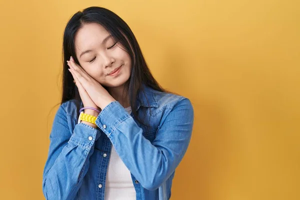 Young Asian Woman Standing Yellow Background Sleeping Tired Dreaming Posing —  Fotos de Stock