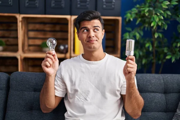 Hispanic Man Holding Led Lightbulb Incandescent Bulb Smiling Looking Side — Photo