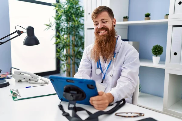 Young Redhead Man Wearing Doctor Uniform Using Touchpad Clinic — Stock Photo, Image