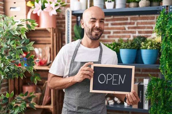 Middle Age Bald Man Working Florist Holding Open Sign Winking —  Fotos de Stock