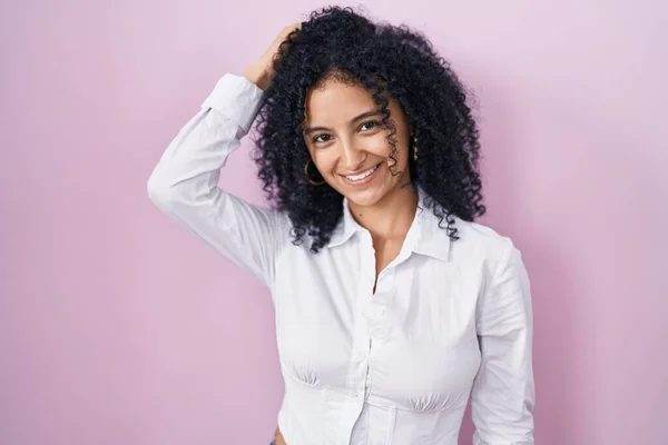 Hispanic Woman Curly Hair Standing Pink Background Smiling Confident Touching — Stockfoto