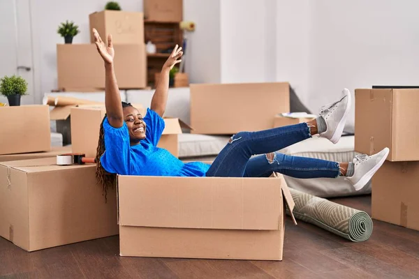 African American Woman Smiling Confident Lying Package New Home — Stock fotografie