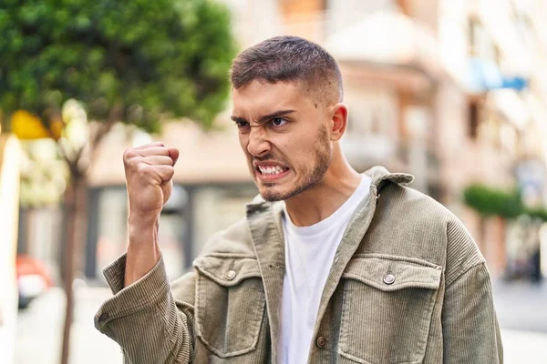 Young Hispanic Man Doing Angry Gesture Fist Street — Stock fotografie