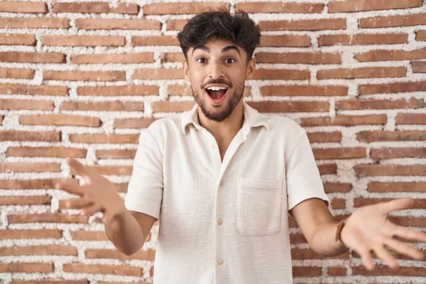 Arab Man Beard Standing Bricks Wall Background Smiling Cheerful Offering — Foto Stock