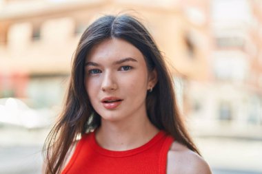 Young caucasian woman smiling confident making selfie by camera at street