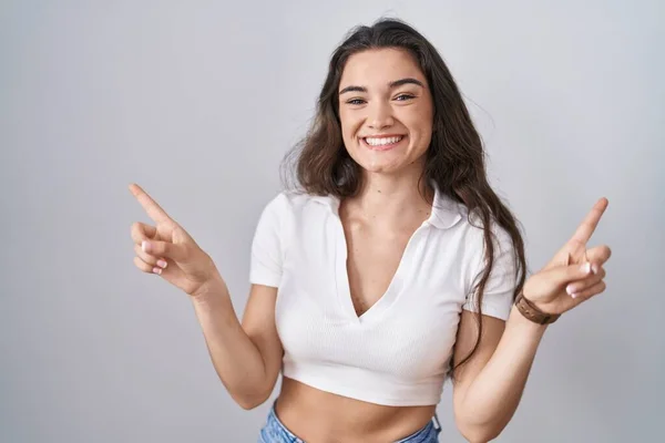Young Teenager Girl Standing White Background Smiling Confident Pointing Fingers — Foto de Stock