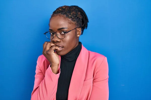 Beautiful Black Woman Standing Blue Background Looking Stressed Nervous Hands — Stockfoto