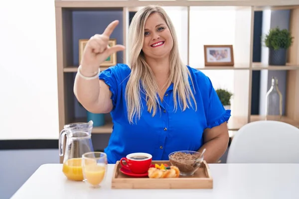Caucasian Size Woman Eating Breakfast Home Smiling Confident Gesturing Hand — Fotografia de Stock