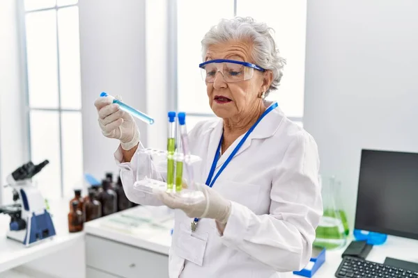 Senior Grey Haired Woman Wearing Scientist Uniform Holding Test Tubes — Stock Photo, Image