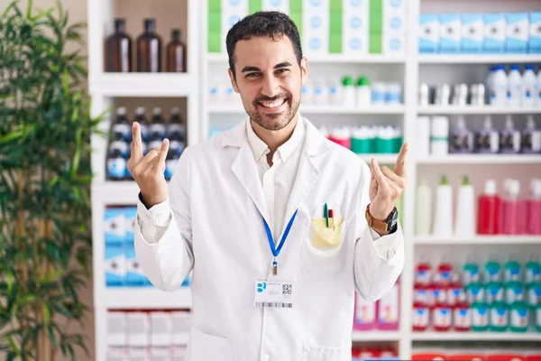 Handsome Hispanic Man Working Pharmacy Drugstore Shouting Crazy Expression Doing — Zdjęcie stockowe