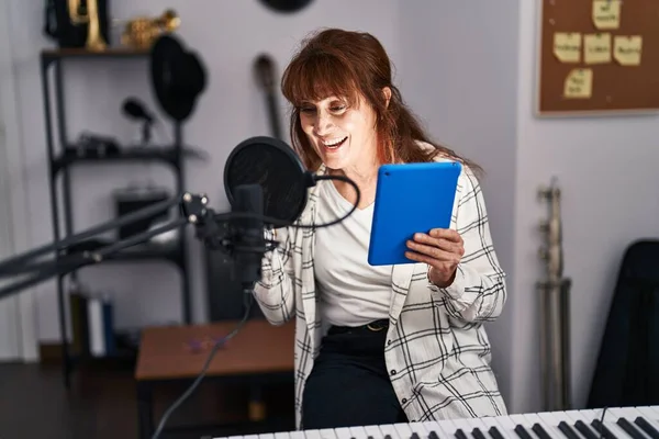 Middle Age Woman Musician Singing Song Holding Touchpad Music Studio — Foto Stock